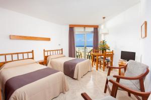 Postel nebo postele na pokoji v ubytování Hotel Panoramica Garden + 37 fotografií