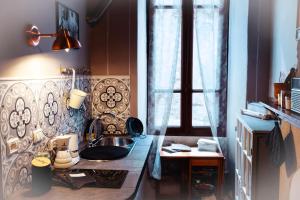 a bathroom with a sink and a window at Il Ciabattino di Ceva in Ceva