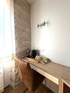 a kitchen with a wooden counter with a microwave at Tea Rooms II in Bale