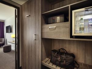 a bag sitting on a shelf in a room at Mercure Versailles Paris Ouest in Versailles