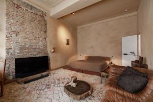 a living room with a couch and a fireplace at Boutique Hotel Verne Dreams in Ghent +44 photos