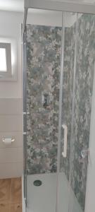 a shower with a glass door in a bathroom at Villini Florence Boutique in Lido di Fermo +27 photos