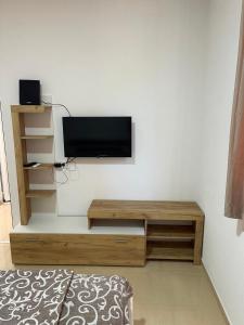 a living room with a flat screen tv on a wall at Apartment with pool Tomic Boka Bay in Herceg-Novi