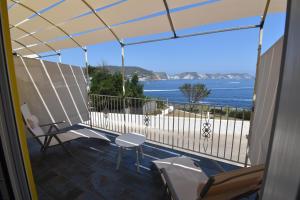 a balcony with a view of the ocean at AzzurroMare Ponza Rooms Sea View by Caseaponza it in Ponza