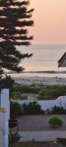 a view of the beach from a house at Aandster in Paternoster