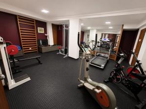 a hotel room with a gym with tread machines at Sarmiento Palace Hotel in Buenos Aires