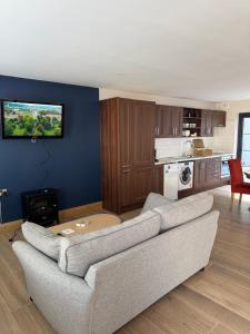 a living room with a couch and a kitchen at The Terrace Collection Number 2 in Tramore