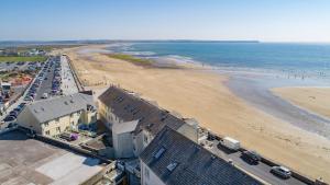 an aerial view of a beach with cars parked at The Terrace Collection Number 2 in Tramore