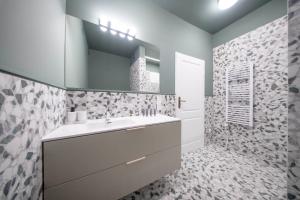 a bathroom with a sink and a mirror at Slawkowska No 6 Residence in Krakow +31 photos
