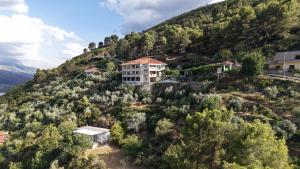 an aerial view of a building on a mountain at Panoramic View House in Tepelenë