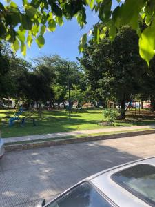 a parking lot with a park with a playground at Adarax Playa Hermosa in Cancún