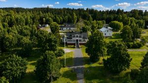 an aerial view of a house in a forest at Villa Fridhem, Härnösand in Härnösand