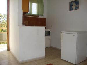 A kitchen or kitchenette at Alex Apartments Még 35 kép