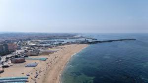 an aerial view of a beach and the ocean at THE ONE Grand Hotel da Póvoa - by MHMB Hospitality in Póvoa de Varzim