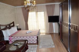 Postel nebo postele na pokoji v ubytování Hotel Begolli