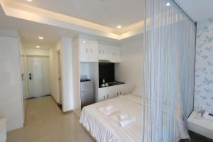 Postel nebo postele na pokoji v ubytování CA&SA Serviced Apartment
