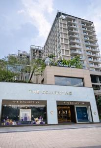 a store in front of a tall building at The Signature Suite in Raipur