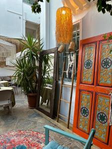 a mirror and a door in a room with plants at Andoya Butik Pansiyon in Bodrum City