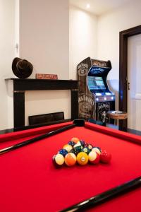 a red pool table with billiard balls on it at Le West - Dinant Centre in Dinant