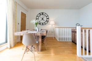 a room with a desk and a clock on the wall at 3 Bed in Bideford oc-52079 in Westward Ho