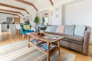 a living room with a couch and a table at 1 Bed in Penzance oc-78517 in Newlyn