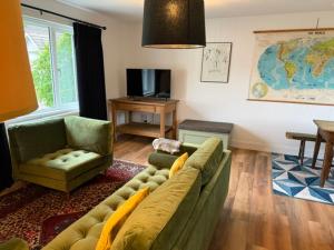 a living room with a couch and a chair at MHOR 84 in Kingshouse