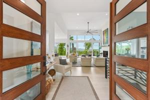 a living room with a wooden door and a living room at Casa del Sueño - Big Canoe, GA - Take a Dip in the Private Swim Spa, Rack Up a Game of Pool, and Stay Active in the In-Home Fitn in Afton