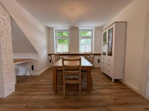 a dining room with a table and chairs at Ferienhaus Anna in Winsen