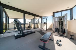 a gym with a treadmill and a bench in a building at VIVASTAY Casablanca -Corniche Le claridge Emerauld with gym and rooftop in Casablanca +16 photos