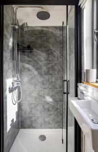 a bathroom with a shower and a sink at Oakwood Marina in Northwich