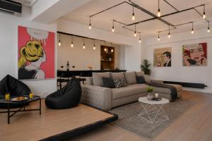 a living room with a couch and a table at RHUM B03 - Dome View in Bucharest