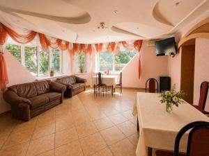 a living room with a couch and a table at Готель Українське in Vinnytsya