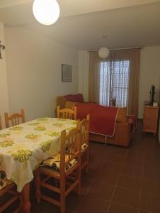 a living room with a table and a couch at Lagunas Ruidera 9 in Ruidera