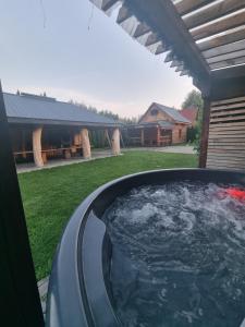 a hot tub in the backyard of a house at Pod Milanem in Przemyśl +4 photos