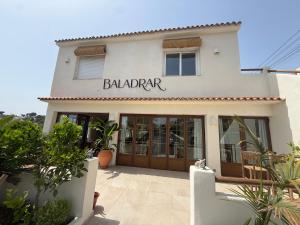 a building with a sign that reads ballater at BALADRAR by Maxim in Benissa +3 photos