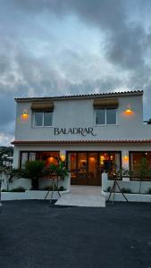 a building with a restaurant with a sign on it at BALADRAR by Maxim in Benissa