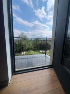 a sliding glass door with a view of a pool at Paceri in Itʼkhvisi
