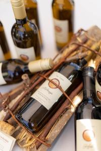 a bunch of bottles of wine on a table at Apartma AURORA in Dekani