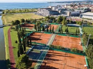 an aerial view of tennis courts next to the water at Apartma AURORA in Dekani