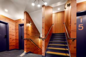 a staircase in a building with a number on the wall at The Foreside Inn in Kittery
