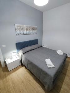 a bedroom with a large bed in a room at Casa Engy in Rocca Imperiale