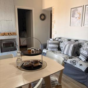 a living room with a table and a couch at Villa Harmony in Kría Vrísi +22 photos