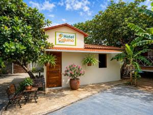 a hotel room with a sign that reads hotel caulking at Hotel Cajuína Beach in Parnaíba