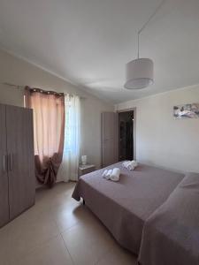 a bedroom with a bed with two towels on it at B&B La Terrazza in Mormanno