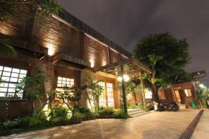 a brick building with a street light in front of it at Java Villas Boutique Hotel & Resto in Yogyakarta