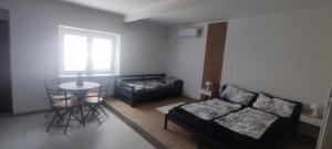 a living room with a couch and a table at Apartmán Domča in Banská Štiavnica