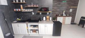 a toy kitchen with a sink and a counter at Apartmán Domča in Banská Štiavnica +4 photos