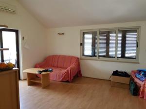 a living room with a couch and a table at Apartment Ante in Račišće