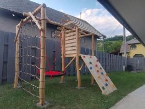 a playground with a slide and a climbing frame at Chalúpka pod Hradom Lednica in Lednica