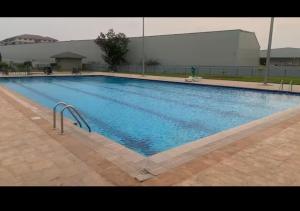 a large swimming pool in a large building at Eden Heights in Tokuse